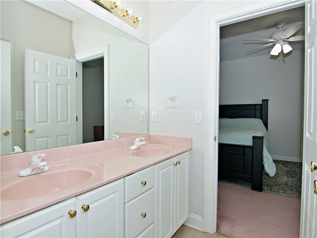 7893 Athens Road Carnesville, GA 30521 - Photo 25 of 50 This bathroom offers a double vanity with ample storage, providing convenience and functionality.