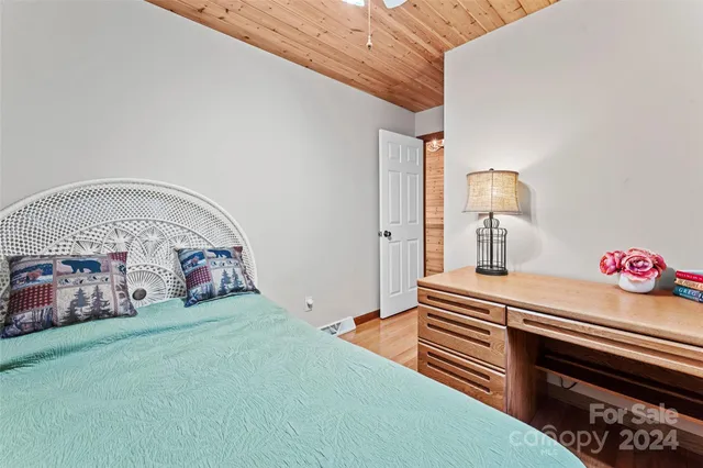 a room with pool table and windows