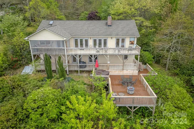 an aerial view of a house with a yard and potted plants