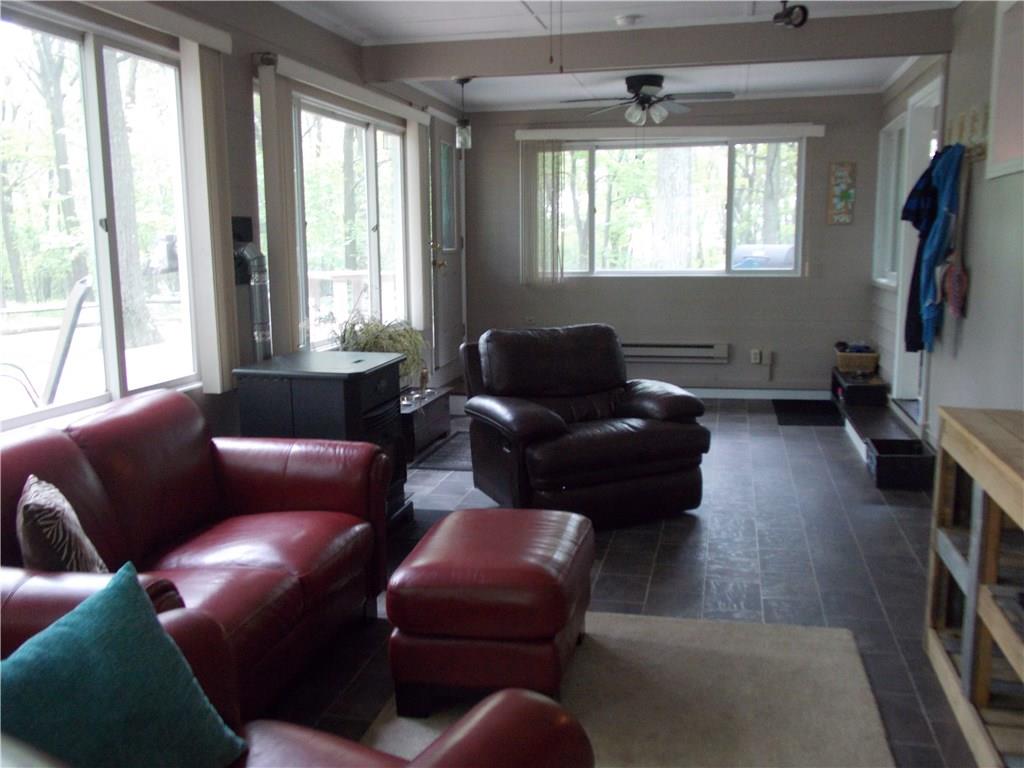 579 Laurel Summit Road Boswell, PA 15531 - Photo 9 of 25 Game room with pellet stove and large windows to look out and enjoy the beautiful surroundings!
