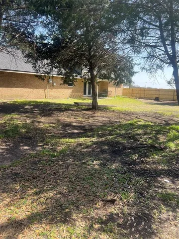 a view of street with large trees