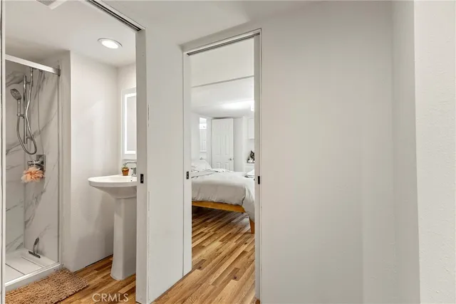a view of a bathroom from a hallway