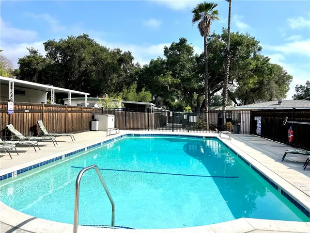 a view of a swimming pool with a lounge chair