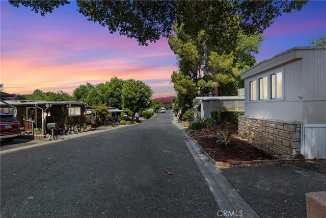 a view of street with parked cars