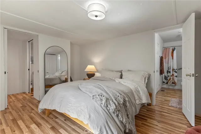 a bedroom with bed and a dresser