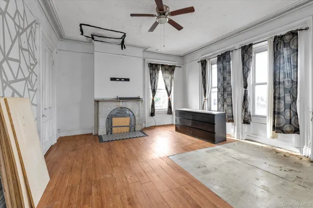 a bathroom with a sink a toilet a mirror and shower