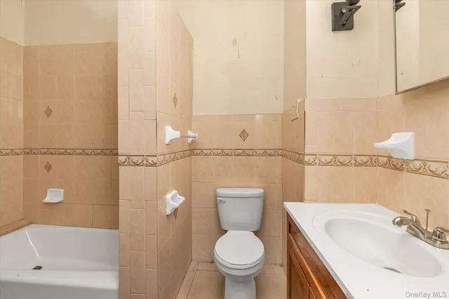 a kitchen with a stove a sink and a refrigerator