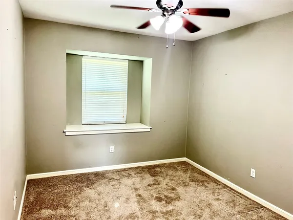 view of an empty room with a window