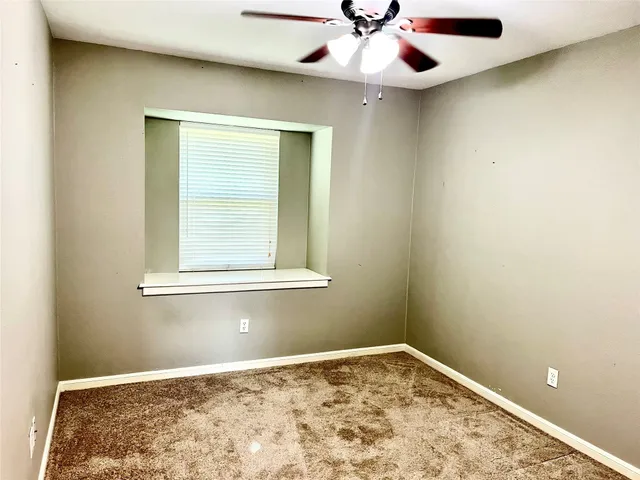 view of an empty room with a window