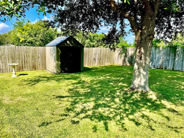a backyard of a house with lots of green space