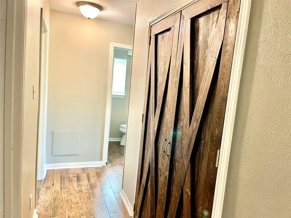 a view of a bathroom with a sink and a mirror