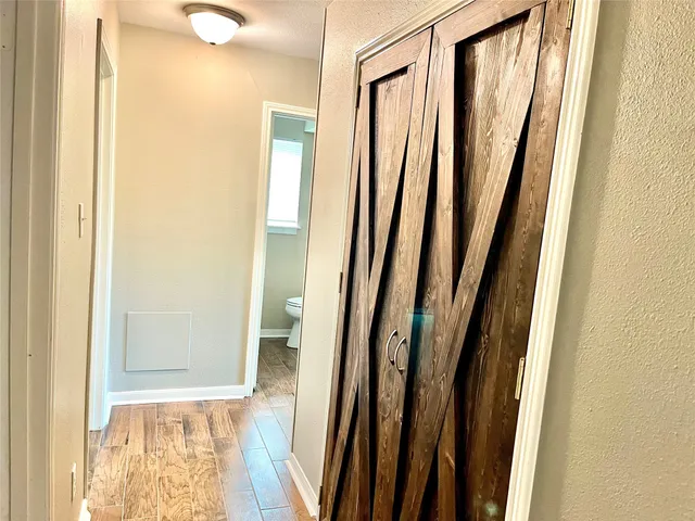 a view of a bathroom with a sink and a mirror