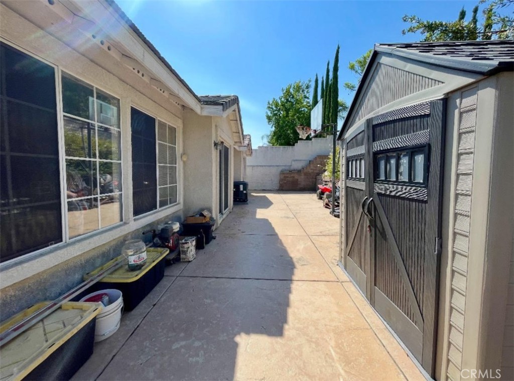 10980 Santa Barbara Place Rancho Cucamonga, CA 91701 - Photo 4 of 4 a balcony with couch and wooden floor