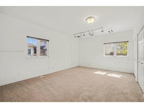 a view of an empty room with a window
