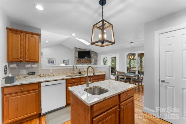 a kitchen with a sink stove and microwave