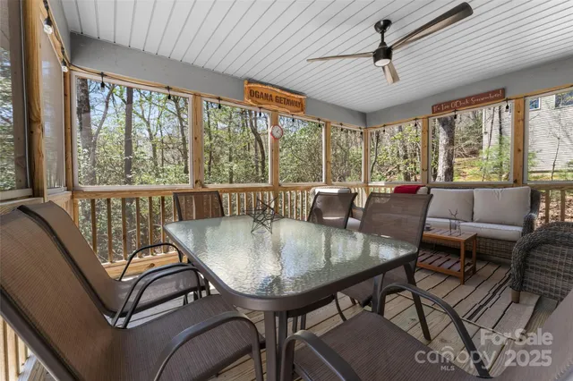 a view of a dining room with furniture window and outside view