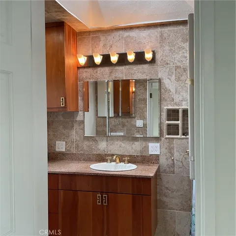 a bathroom with a sink toilet and tub