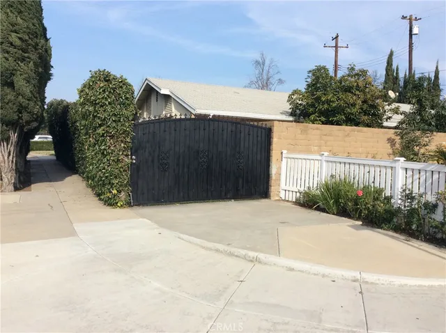 a kitchen with granite countertop white cabinets and stainless steel appliances