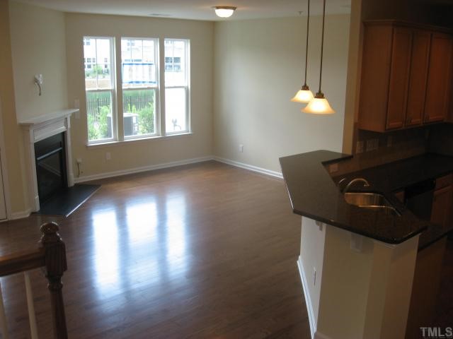 9133 Wooden Road, Unit 242 Raleigh, NC 27617 - Photo 3 of 9 Open Living/Dining Room with Fireplace!