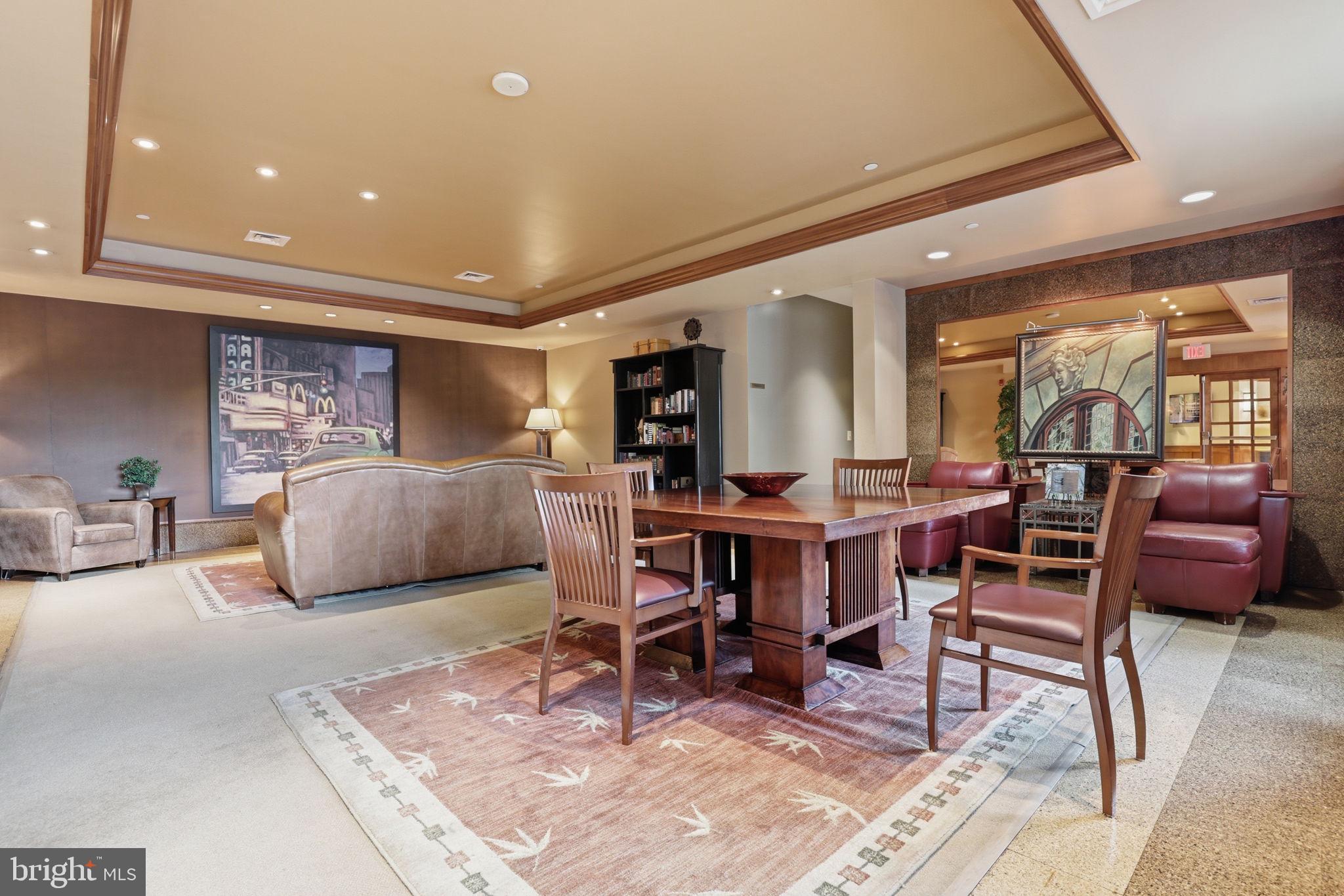 11800 Sunset Hills Road, Unit 218 Reston, VA 20190 - Photo 34 of 38 a living room with furniture a rug and a table