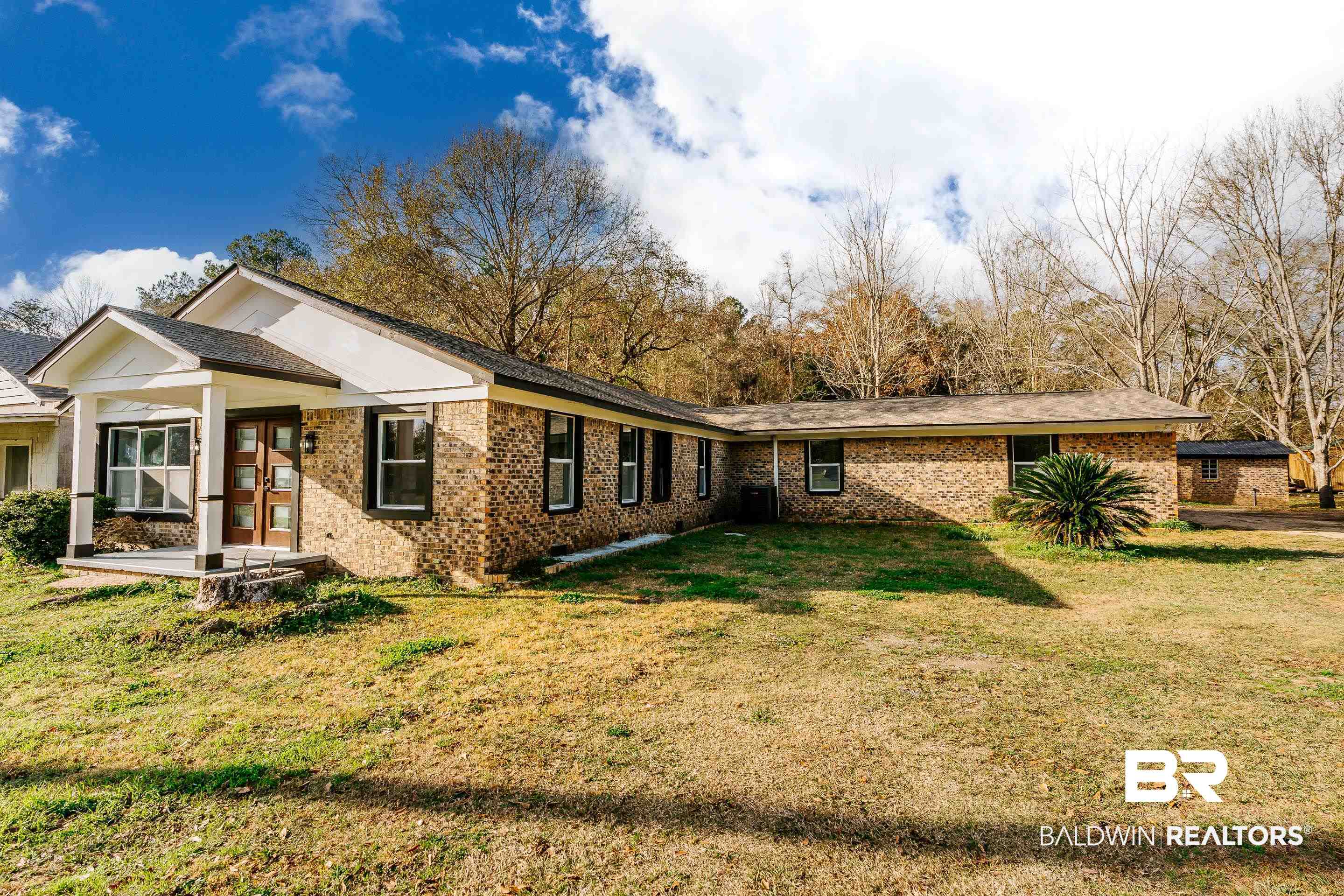 1190 Military Road Mount Vernon, AL 36560 - Photo 38 of 47 Back of property featuring a yard, brick siding, and covered porch