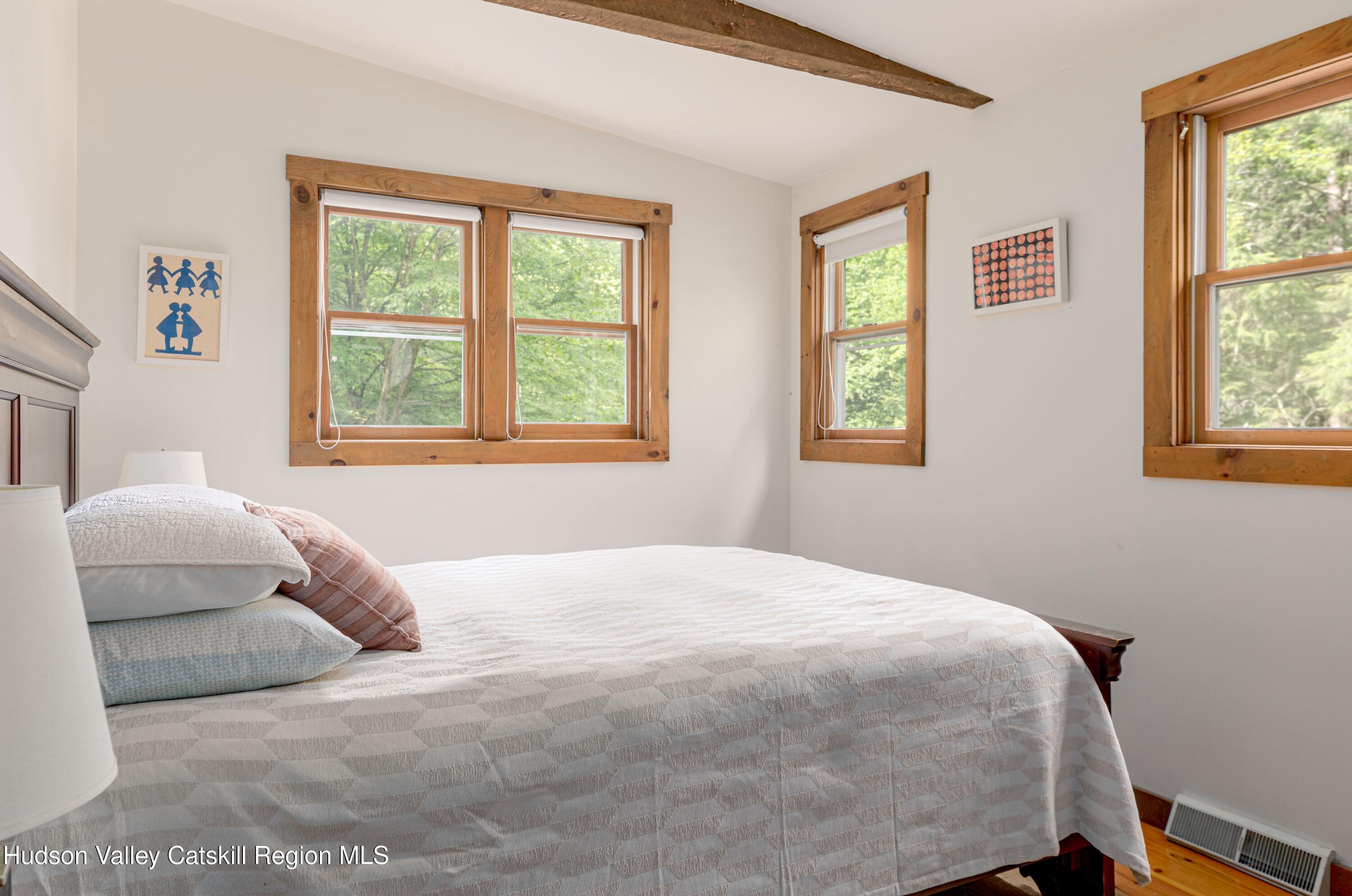 22 Old Mill Road Stephentown, NY 12169 - Photo 41 of 55 a bedroom with a bed and a window