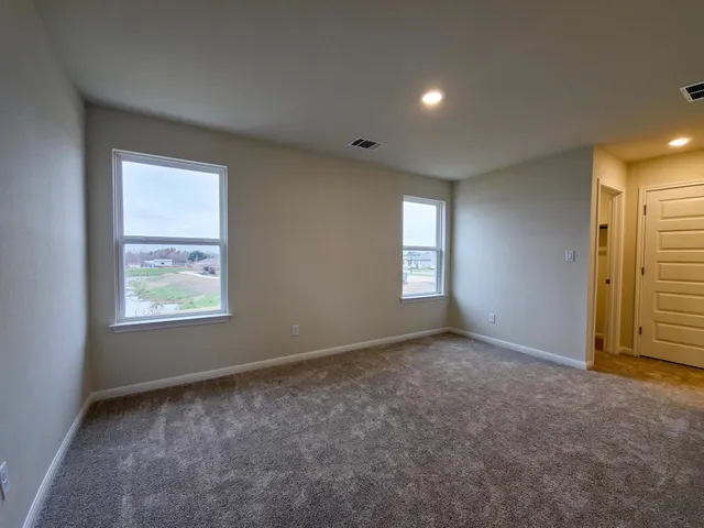 an empty room with windows