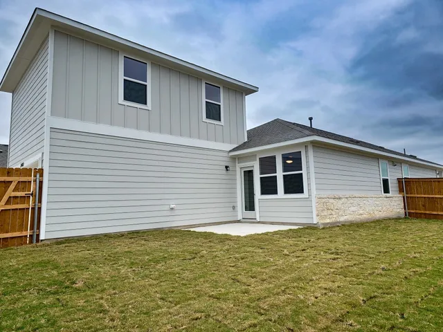 a front view of a house with large windows