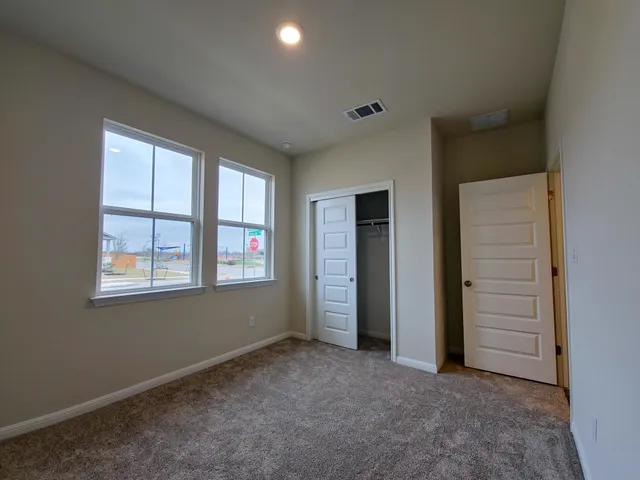 an empty room with windows