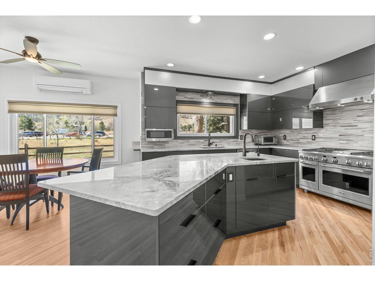 4825 6th Street Boulder, CO 80304 - Photo 11 of 50 a kitchen with stainless steel appliances granite countertop a stove and cabinets