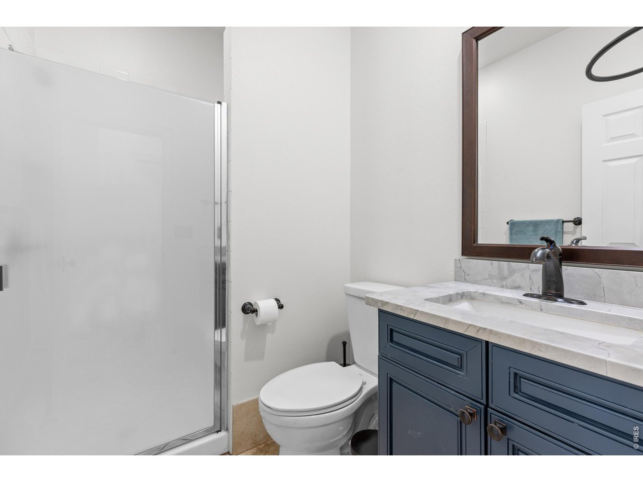4825 6th Street Boulder, CO 80304 - Photo 15 of 50 a bathroom with a granite countertop toilet sink and mirror