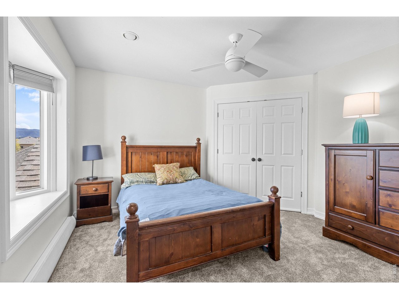 4825 6th Street Boulder, CO 80304 - Photo 23 of 50 a bedroom with a bed window and a table