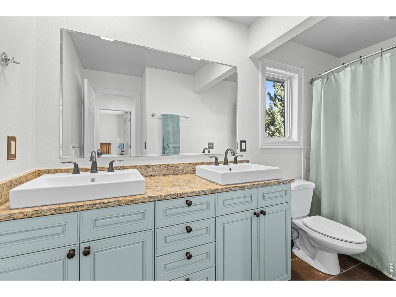 4825 6th Street Boulder, CO 80304 - Photo 25 of 50 a bathroom with a granite countertop sink mirror and toilet