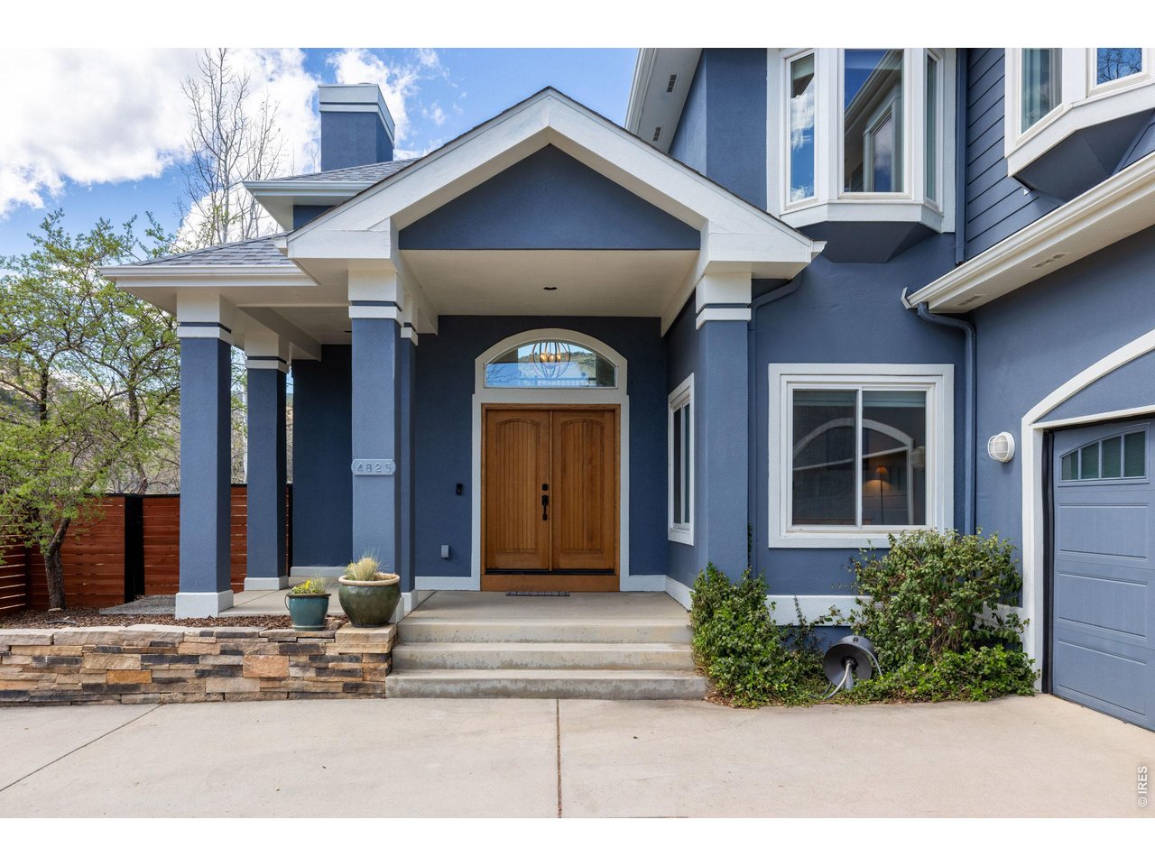 4825 6th Street Boulder, CO 80304 - Photo 44 of 50 a front view of a house with garden