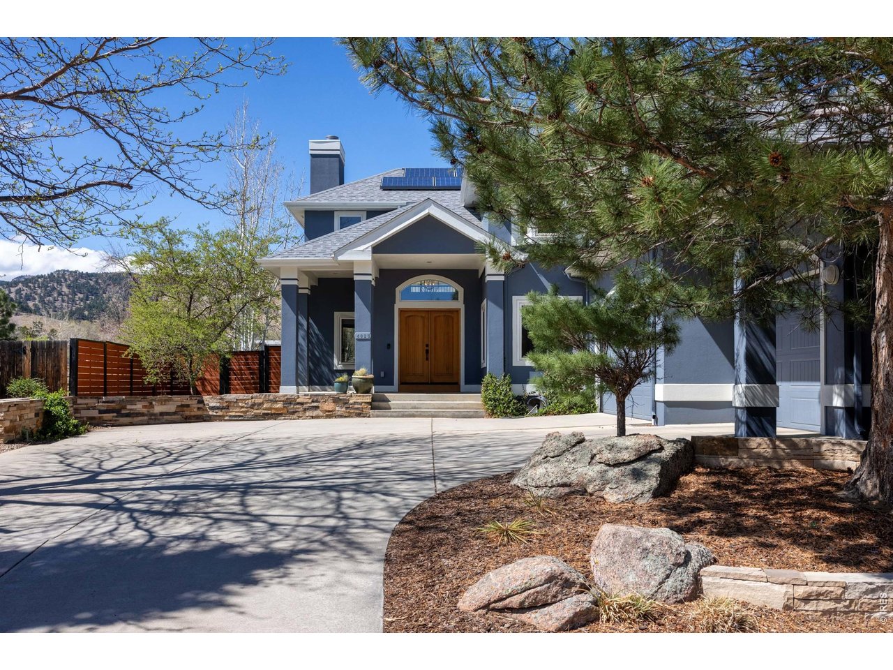 4825 6th Street Boulder, CO 80304 - Photo 45 of 50 a front view of a house with a yard