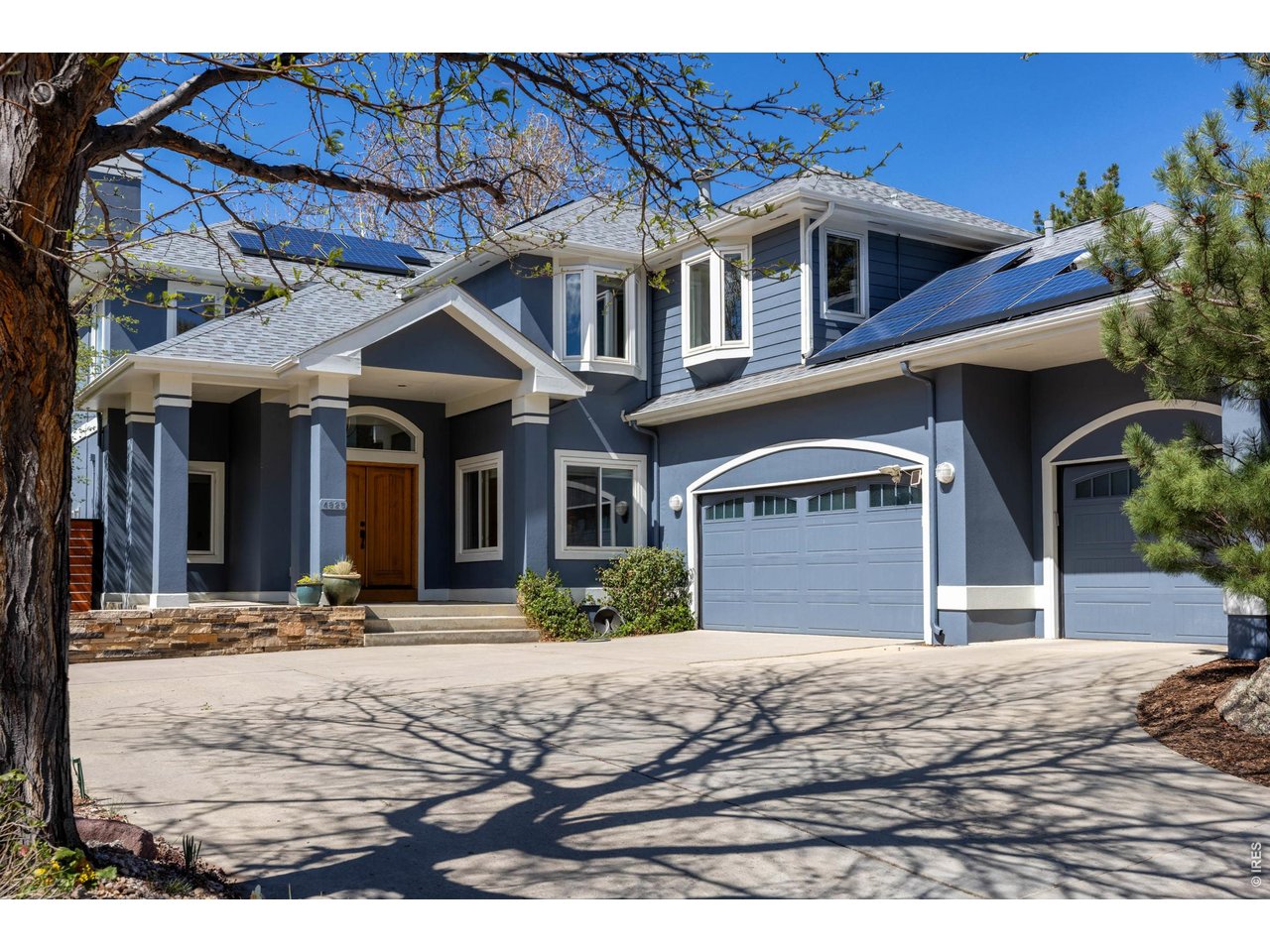 4825 6th Street Boulder, CO 80304 - Photo 46 of 50 a front view of a house with a yard