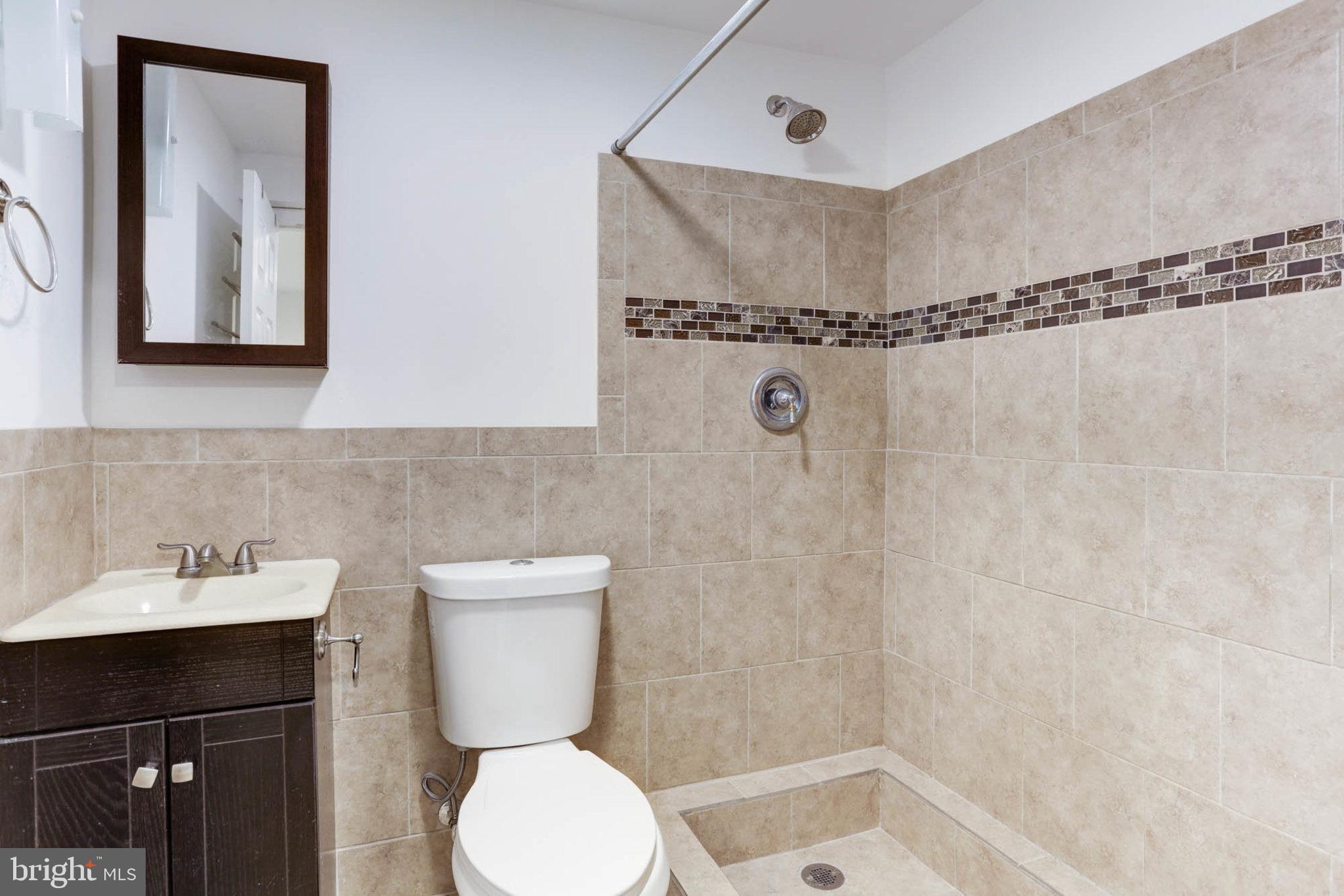 7465 Browns Bridge Road Highland, MD 20777 - Photo 34 of 37 a bathroom with a sink toilet and shower