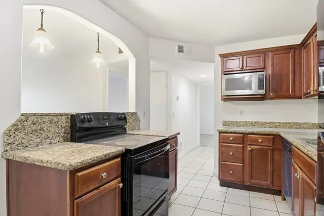 a kitchen with a stove and a microwave