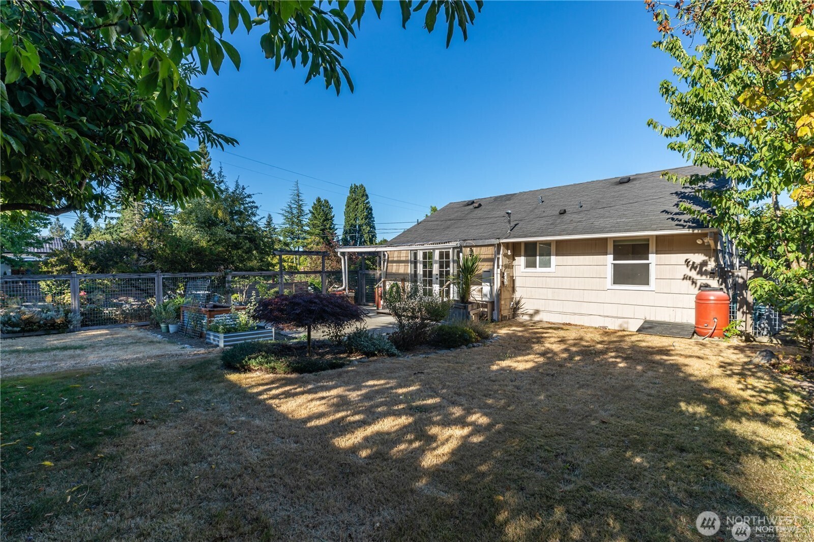 8601 36th Avenue Southwest Seattle, WA 98126 - Photo 23 of 28 a view of a house with backyard and sitting area