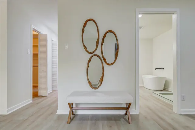 a living room with furniture a table and wooden floor