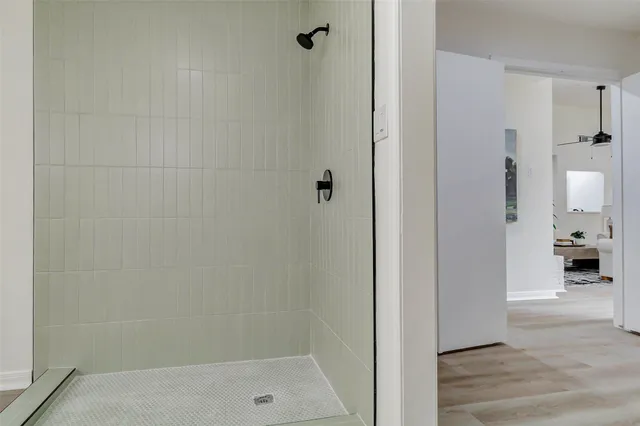 a view of a room with wooden floor