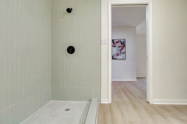 a view of a room that has wooden floor in it