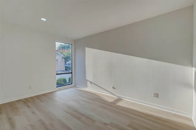 a view of an entryway with wooden floor