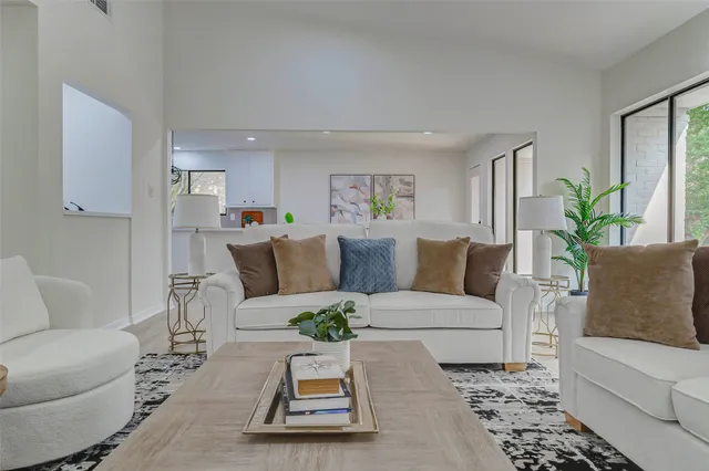 a living room with furniture and a rug