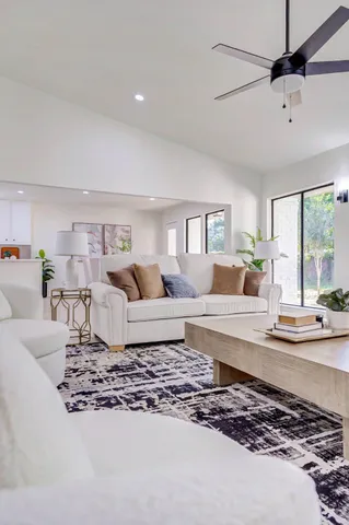 a living room with furniture and a rug