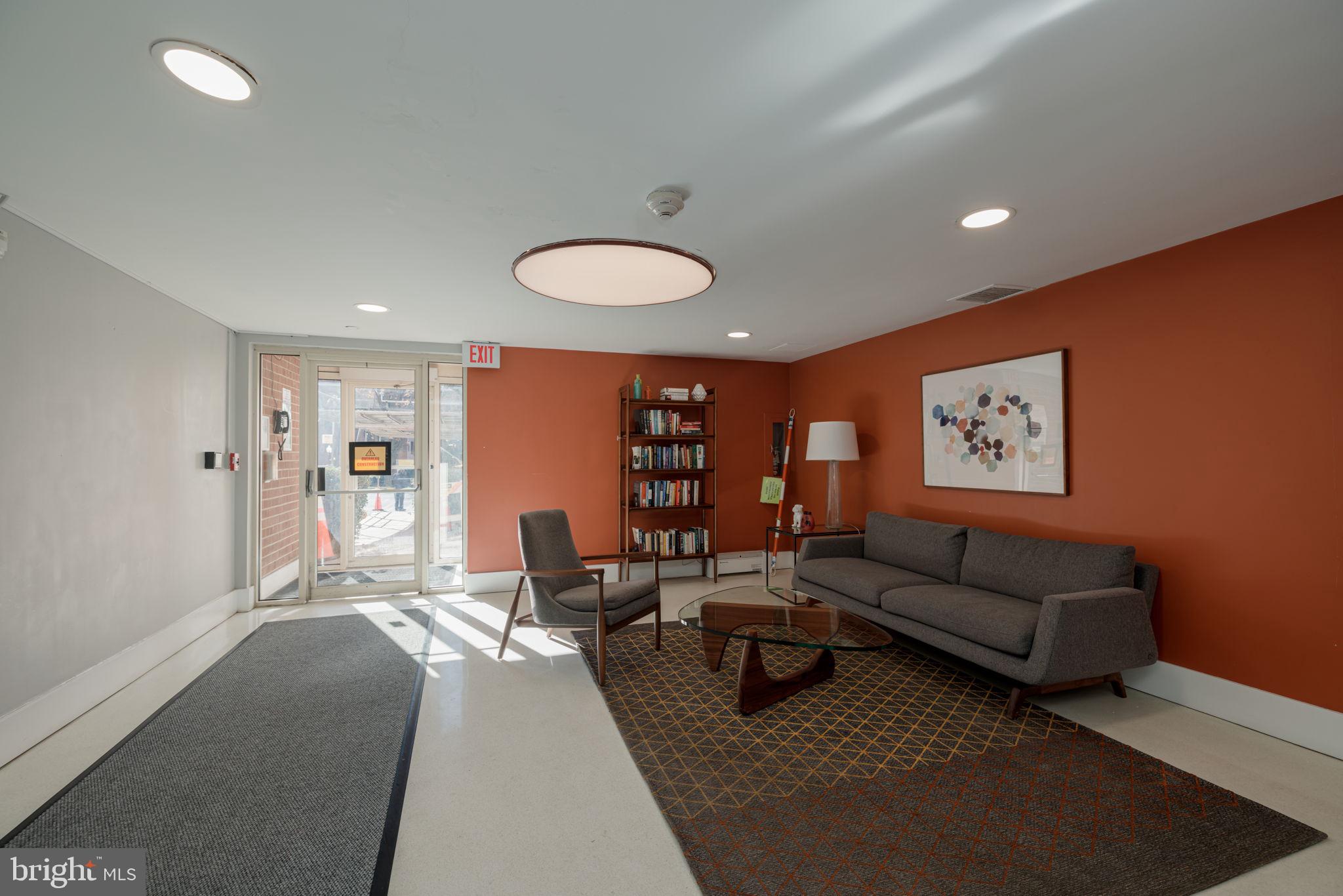 4000 Tunlaw Road Northwest, Unit 600 Washington, DC 20007 - Photo 17 of 27 a living room with furniture and a table