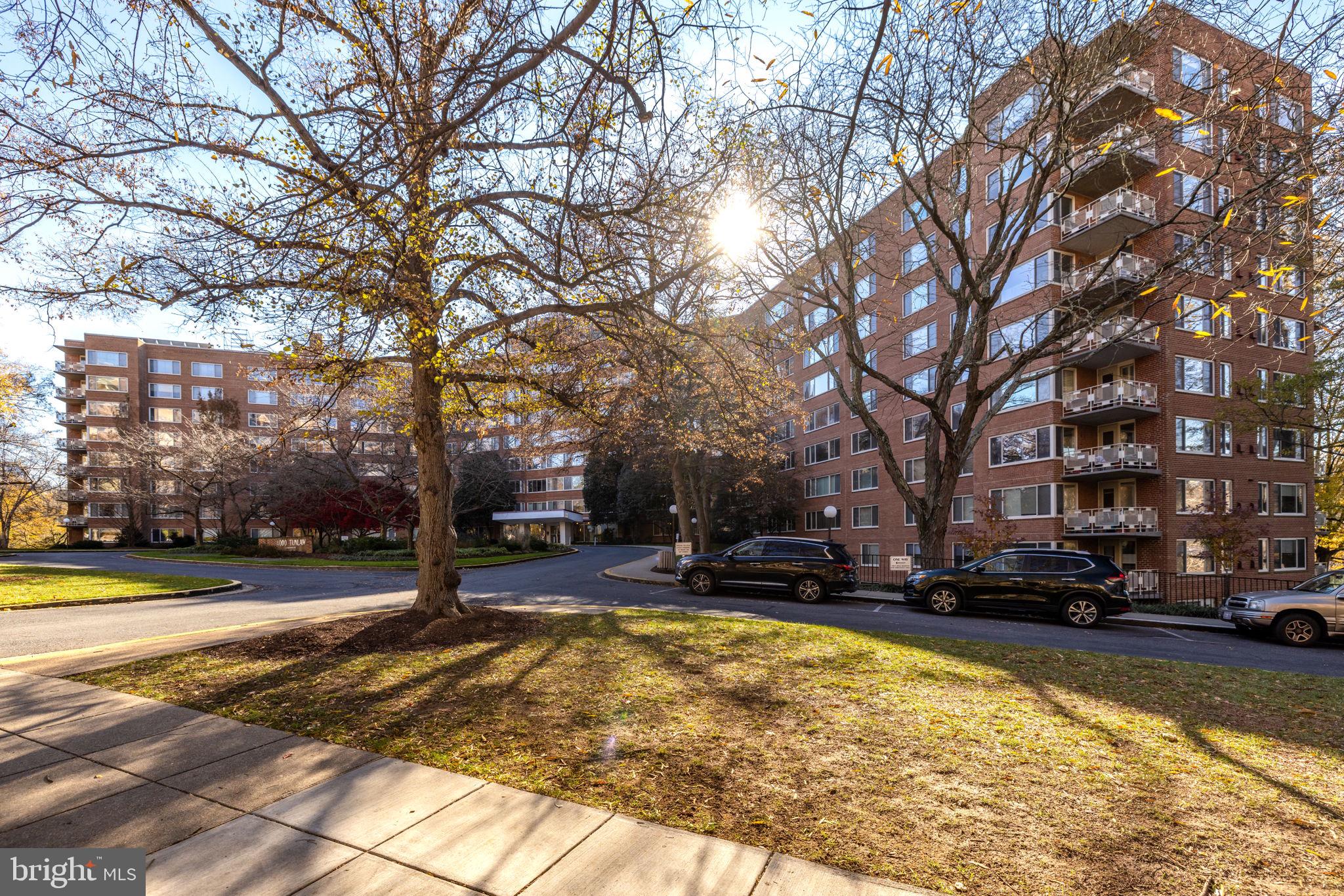 4000 Tunlaw Road Northwest, Unit 600 Washington, DC 20007 - Photo 25 of 27 a view of a swimming pool with trees and buildings in the background