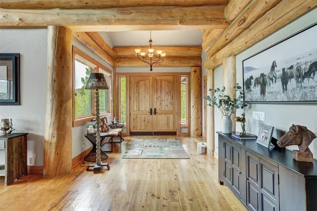 a view of a dining room with furniture wooden floor and chandelier