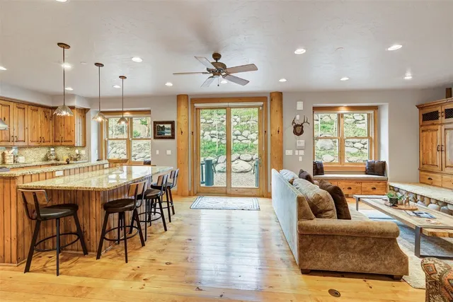 a kitchen with stainless steel appliances granite countertop a stove and a refrigerator