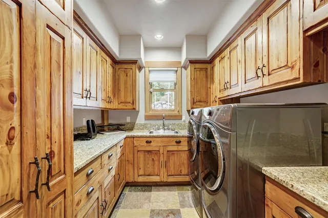a bedroom with a bed a flat screen tv and a fireplace